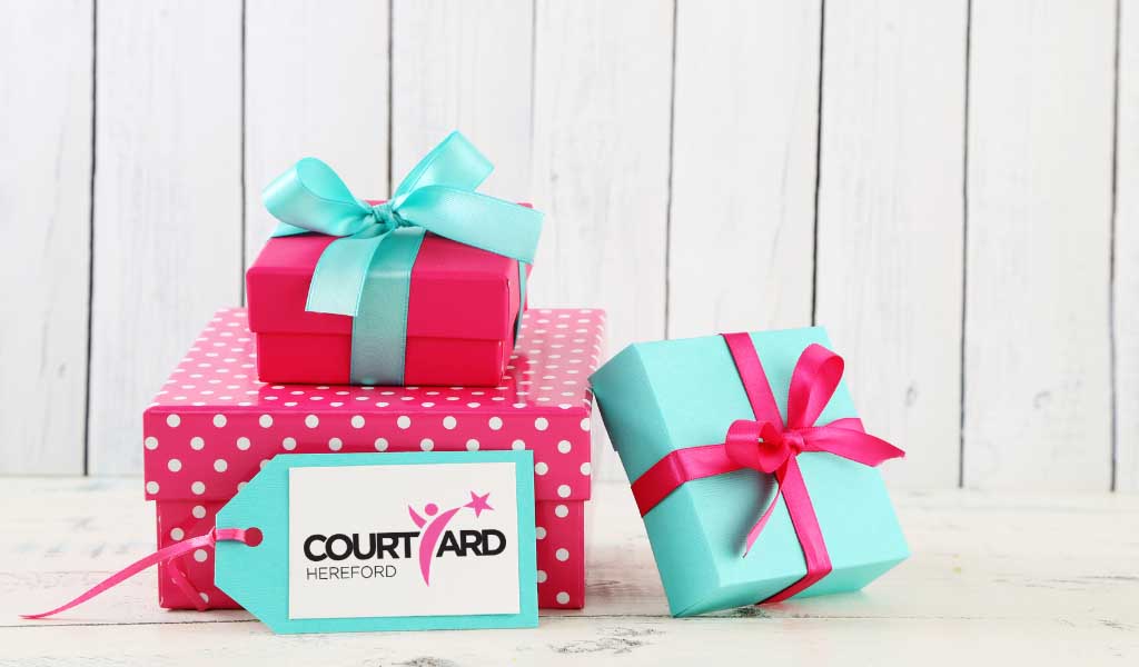 Pink and blue gifts with Courtyard logo - Courtyard Gift Vouchers
