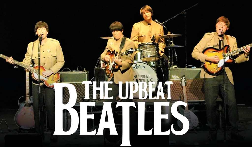 The Upbeat Beatlest Title Image - band posing with instruments behind title text