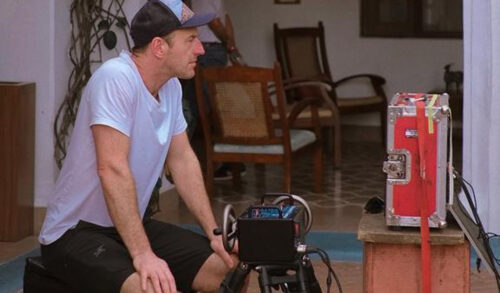 Film practitioner Will Humphris sitting behind film making equipment