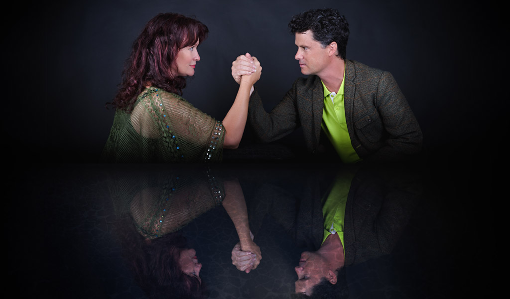 Kathryn Roberts and Sean Lakeman having an arm wrestle