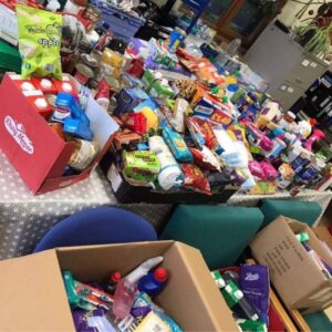 Donations spread across a table and chairs