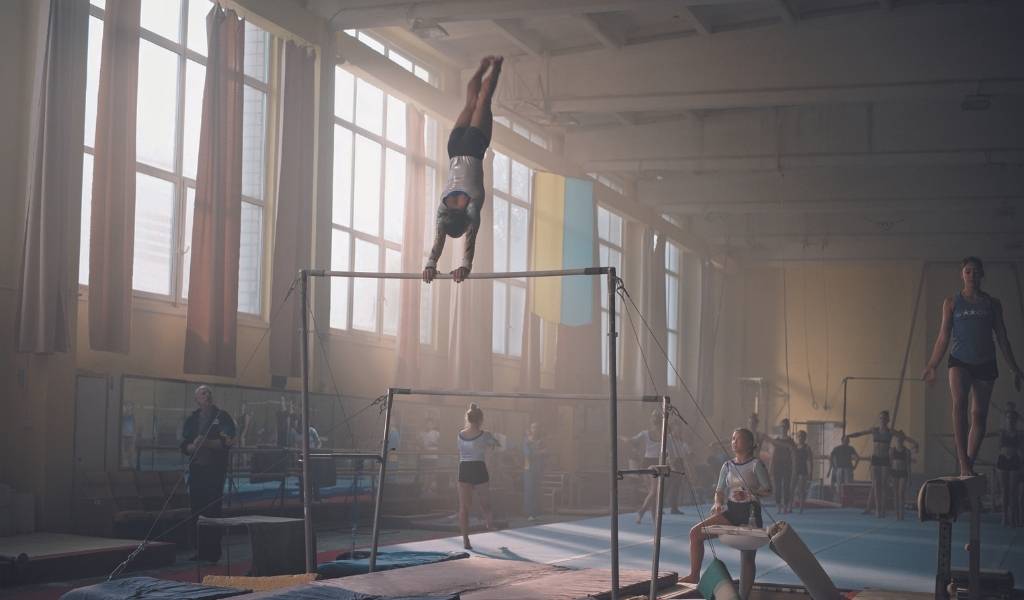 Olga, Image - A group of gymnasts practice in a large room