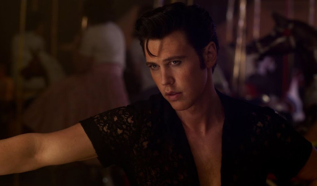 Elvis (12A), Image - Austin Butler as Elvis stands in an open chested shirt