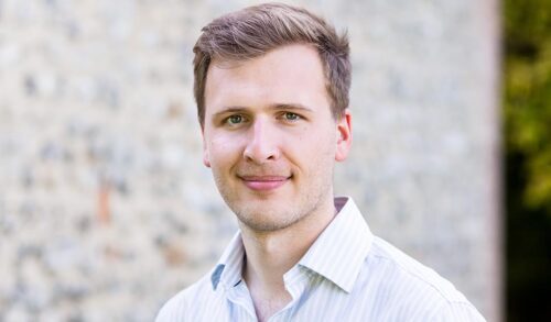 Headshot of childrens author Luke Aylen a white man with short brown hair