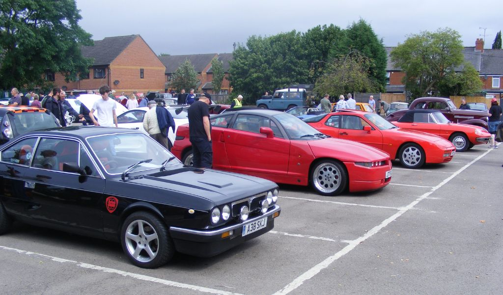 The Courtyard Motor Show 2022 brings in the cars and the crowds, image: a line of vintage sports cars in a car park