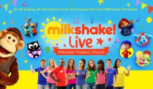 'milkshake live! Milkshake! Monkey's Musical - an all singing, all-dancing live show starring your favourite Milkshake! characters' written above nine people stood smiling in brightly coloured tops. A toy monkey peers round the side of the image on the left hand side. Different cartoon characters are dotted around the image in circles.