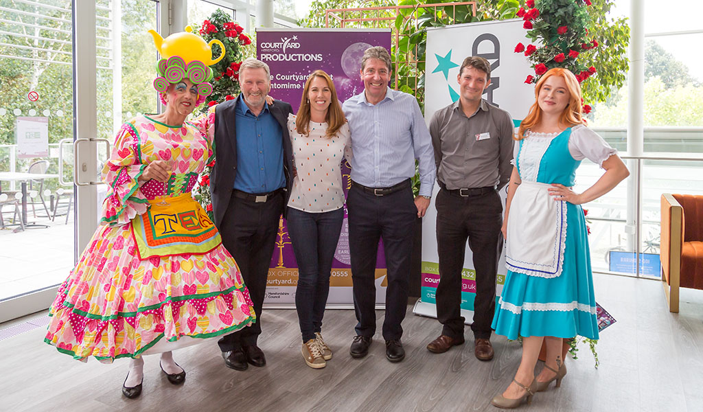 Joanna Cobb and staff stand with 2 characters from The Courtyard Pantomime