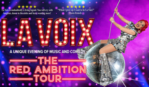 La Voix a red haired drag queen swinging from a glitter ball The writing reads La Voix the red ambition tour A unique evening of music and comedy
