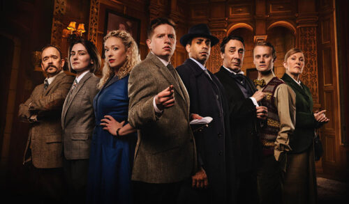 The Mousetrap Cast stood in a line looking at camera