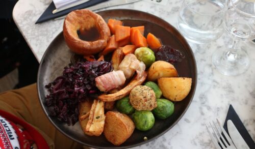 A traditional Christmas roast dinner on a marble table