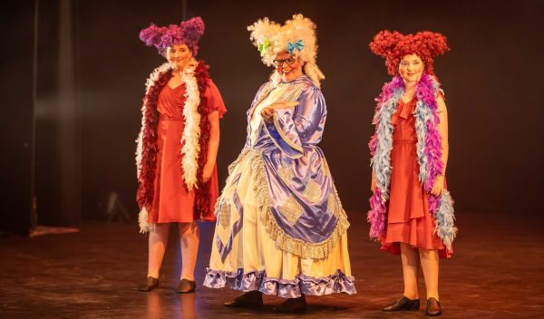 Three pantomime characters onstage 