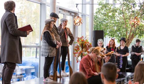 A group of young people performing on stage in The Courtyard Lounge