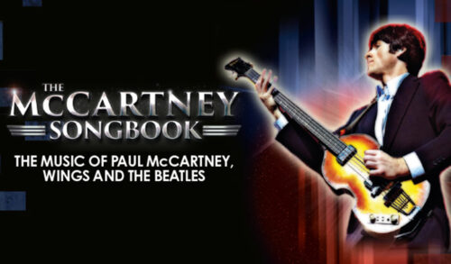 An image of a man dressed as Paul McCartney holding a guitar Writing reads The McCartney Songbook The music of Paul McCartney Wings and The Beatles