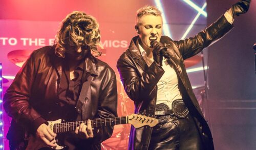 Two singers performing as Eurythmics on stage