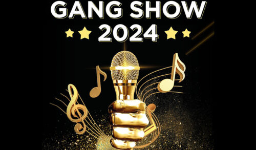 A gold hand holding a microphone Wording reads Gang Show 2024