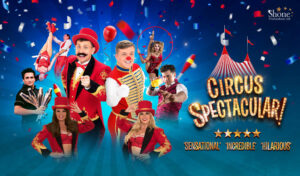 Circus Spectacular - A group of circus performers stand surrounded by circus props. Writing reads 'Circus Spectacular!'