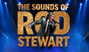A Rod Stewart lookalike singing into a microphone. He is surrounded by blue haze. Writing reads 'The Sounds of Rod Stewart' in gold, glittery writing