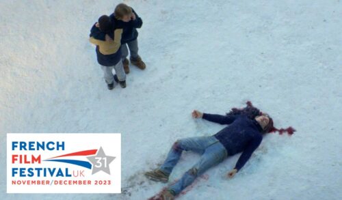 The body of a man lies in the snow with blood pouring from their head Stood to the side is two people