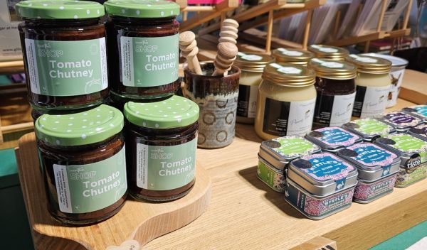 A shop display of chutneys and different jars