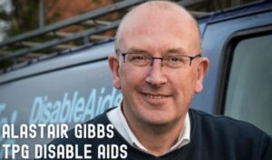 An image of a man smiling. Writing reads 'Alastair Gibbs TPG Disable Aids'