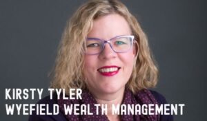 A blonde woman wearing glasses smiles at the camera. Writing reads 'Kirsty Tyler, Wyefield Wealth Management'