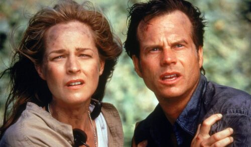 A still image from the film Twister in which Helen Hunt and Bill Paxton look toward the camera