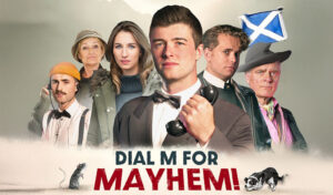 Dial M For Mayhem - 6 people stand behind a banner which reads Dial M For Mayhem