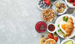 A table with various brunch dishes laid out.