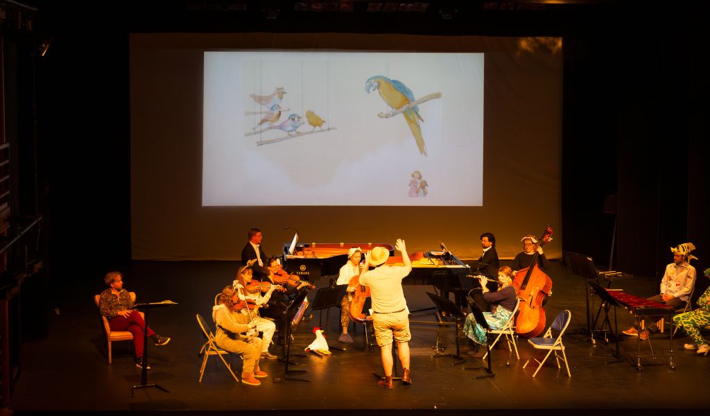 An orchestra performs on stage