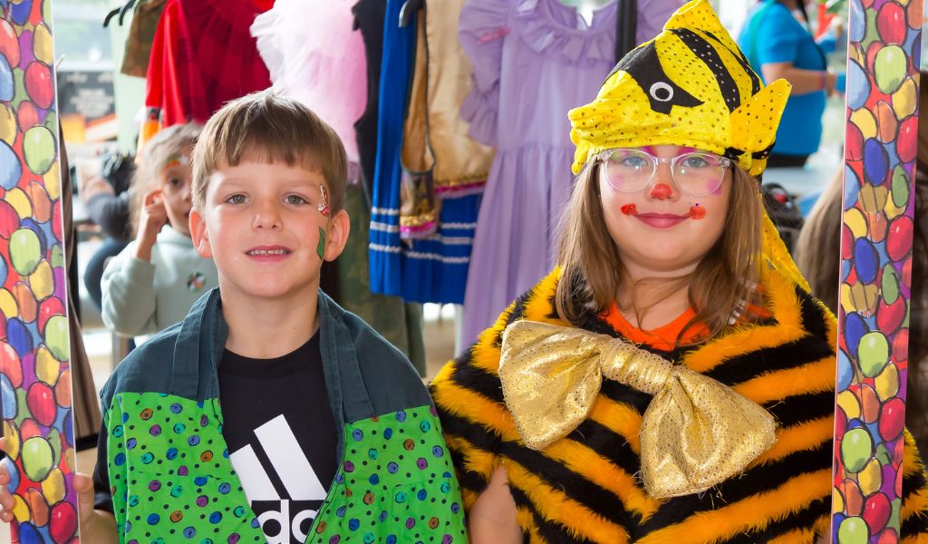 Two young children pose in costume
