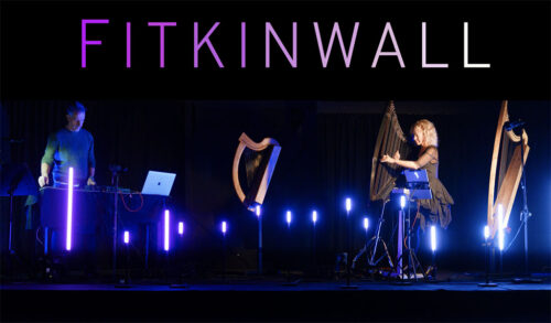 Harpland 2 people on stage with harps  FitkinWall is written above them
