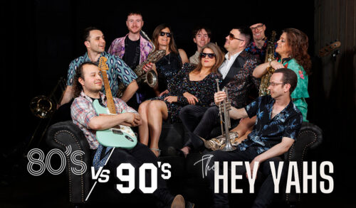 Hey Yahs 80s vs 90s  a group of people in sunglasses holding instruments sit laughing