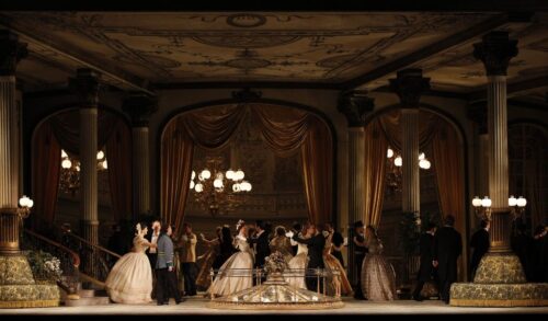 A large stage on which a ballroom dance is taking place