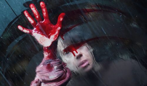 A woman smears blood across a wet window with her hand