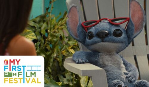 A blue alien creature sits on a deck chair with red glasses on top of his head In the bottom left is the My First Film Festival logo