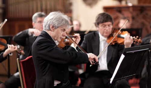 Two individuals playing instruments