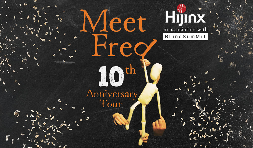 : A hand puppet holding onto the D in ‘Meet Fred’. The text reads ‘Meet Fred 10th Anniversary Tour – Hijinx Theatre in association with BlindSummit’.