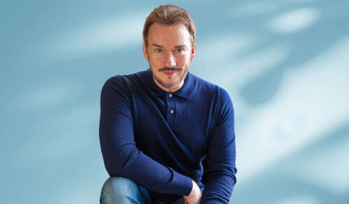 Russell Watson  a man with blond hair and a moustache