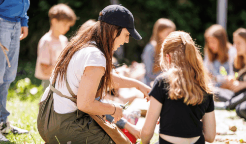 A group of young people sitting in a circle talking