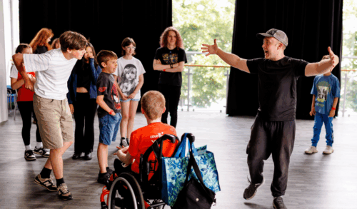 A group of young people laughing and acting