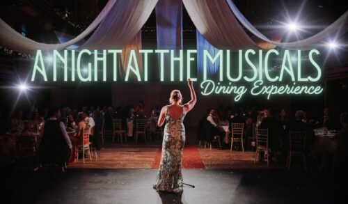 An image of a woman in a ballgown standing at a microphone in front of a crowd of people Text reads Night At The Courtyard Musicals  Dining Experience