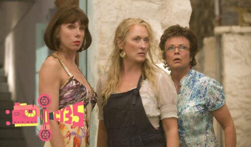 Meryl Streep Julie Walters and Christine Baranski stand together In the bottom left is a graphic of a film projector with the name CY35 being projected from it
